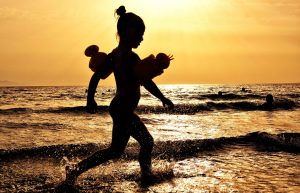 girl in sea at sunset-1